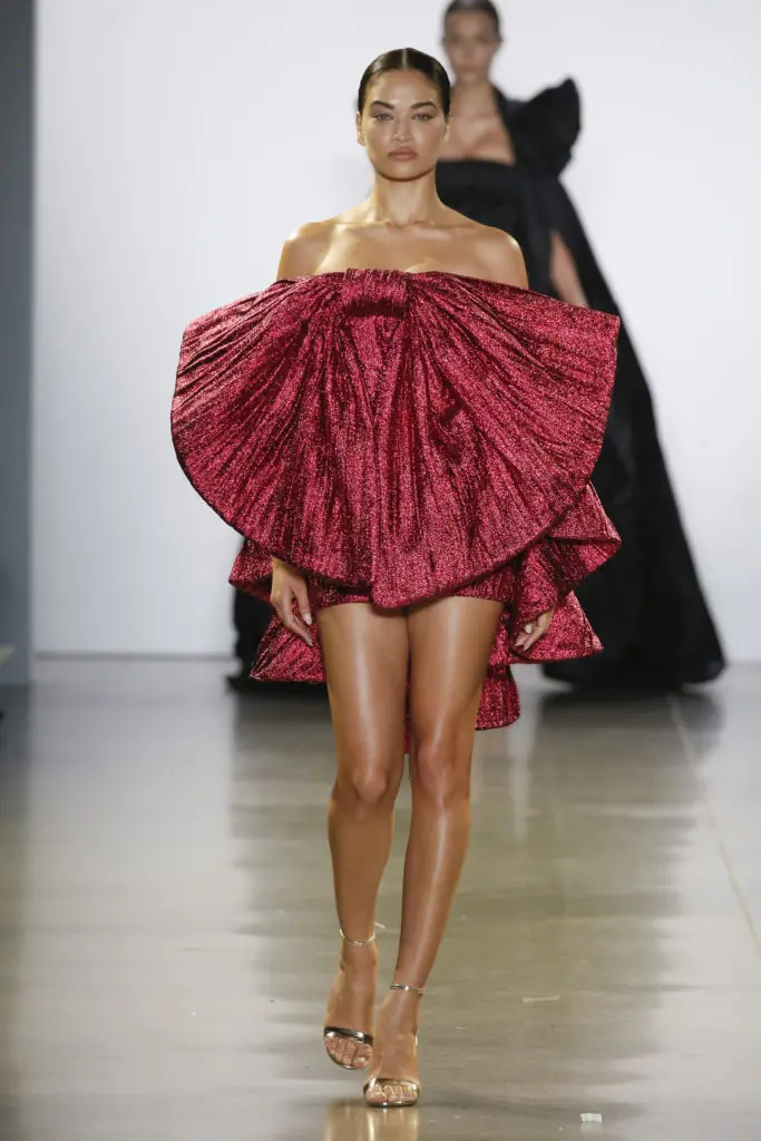 Victoria's Secret model Shanina Shaik comes down the runway in a revealing bow-shaped dress. (Photo by Cong Tri)