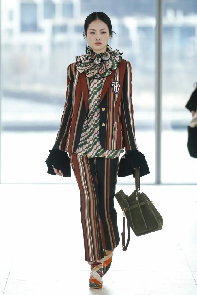 Tory Burch striped wool blazer with TB logo and wool pant, geo-print satin top (Photo by Tory Burch)