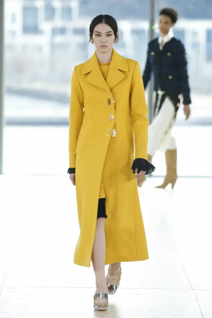 Tory Burch yellow wool coat, crepe de chine dress with chiffon cuff (Photo by Tory Burch)