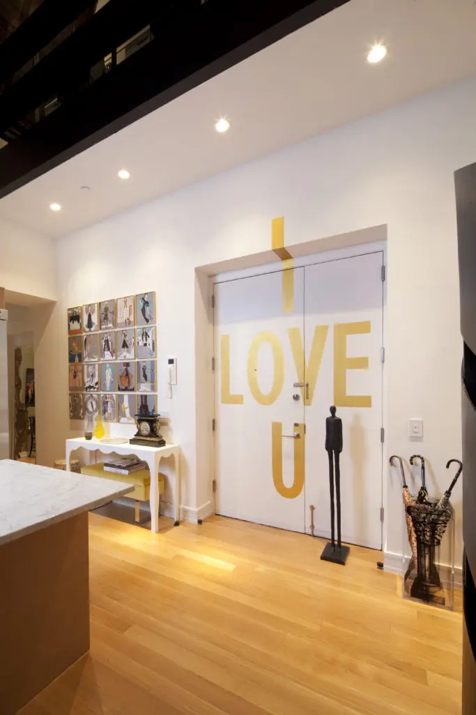 Loya commissioned a New York artist to paint ' love U' on the back of the apartment's front door. (Photo by Julie Soefer)