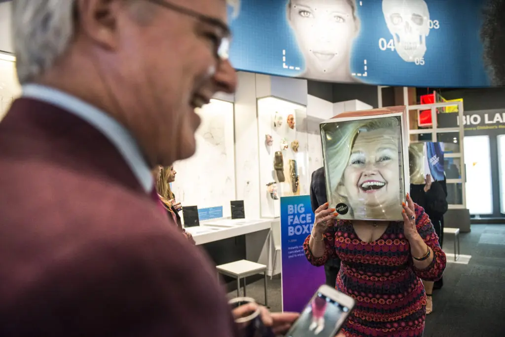 Trying on Big Face Boxes in the Being Human Hall (Photo by Turk Studio)