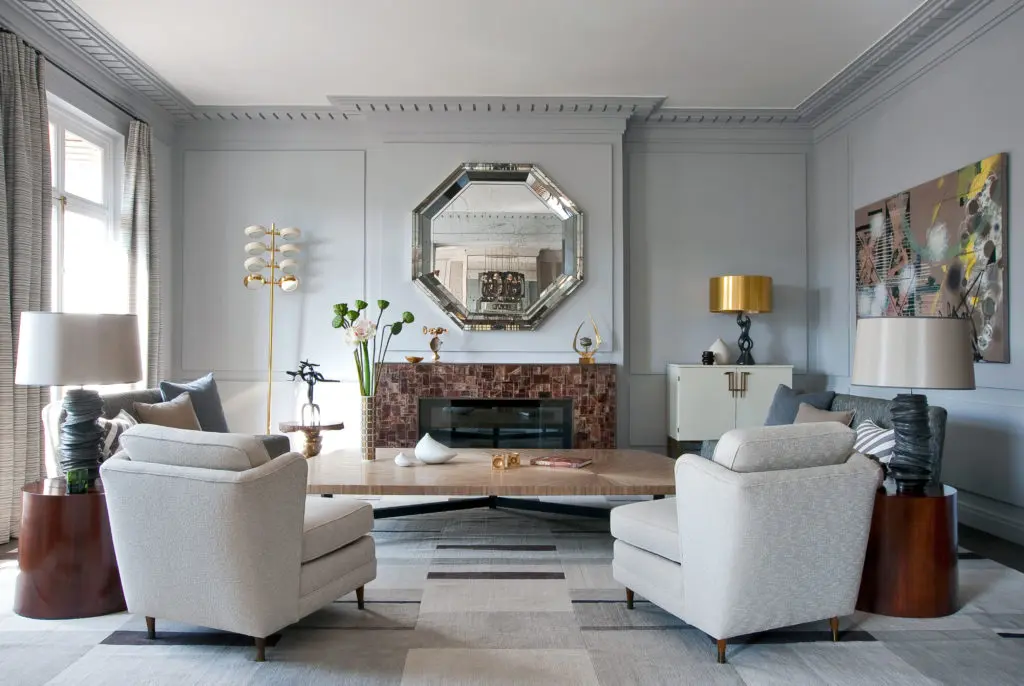 n an apartment on Avenue d'Eylau in Paris, straw marquetry coffee table by Lison de Caunes, designed by Deniot;  cubist custom carpet by Galerie Diurne designed by Deniot.