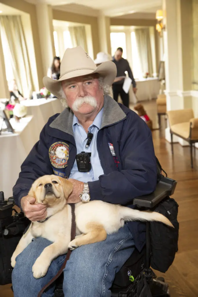 Veteran Bill Callahan and his  service dog at the 
Easter Seals of Greater Houston Hats Off to Mothers luncheon. (Photo by Jenny Antill Clifton)