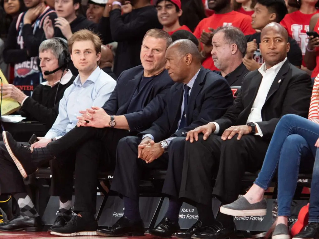 Patrick Fertitta, Tilman Fertitta and Houston Mayor Sylvester Turner enjoy a University of Houston basketball win. (Photo by F. Carter Smith)