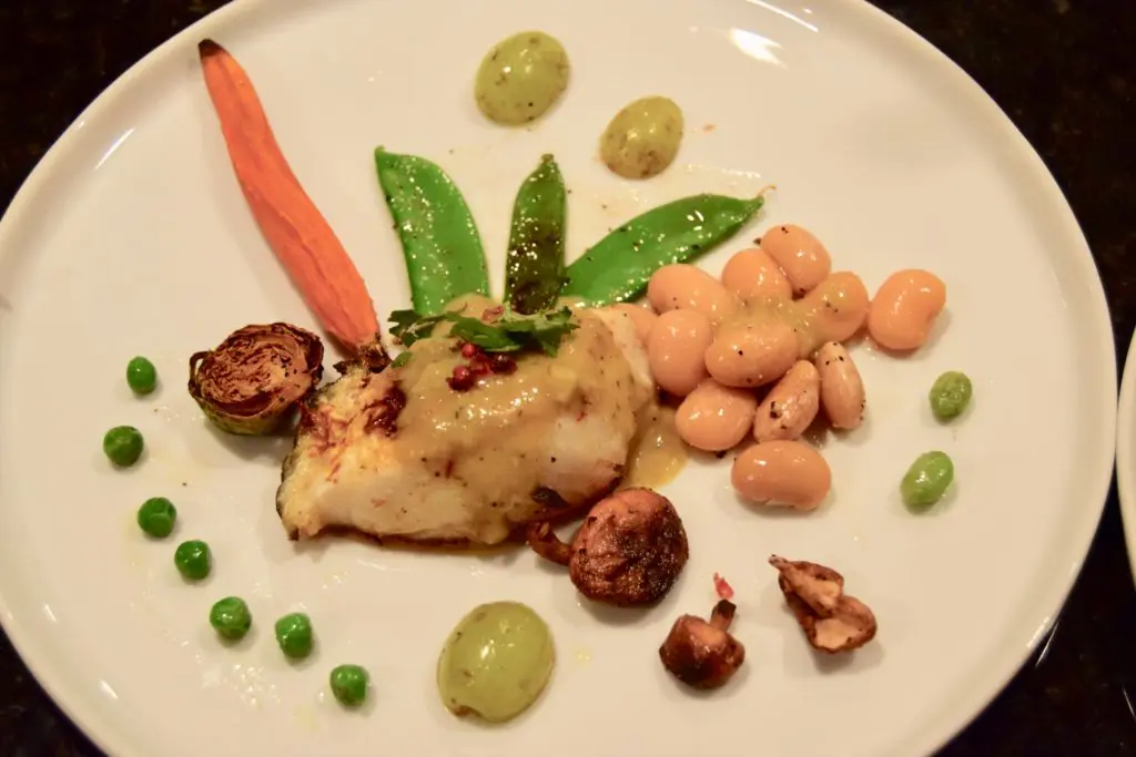 Fady Armanious' charred lemon saffron sea bass with figs and peas. (Photo by Shelby Hodge)