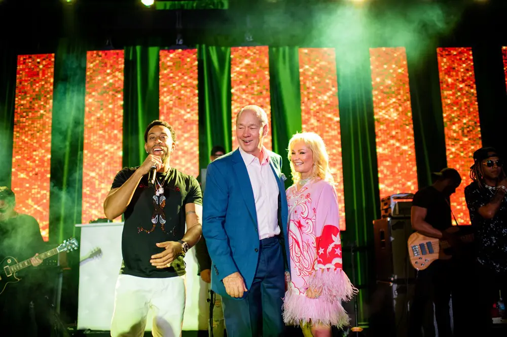 Ludacris on stage with Jim & Whitney Crane at her birthday party in Palm Beach, Florida. (Photo by Oona Beyer, Dragonfly Photography)