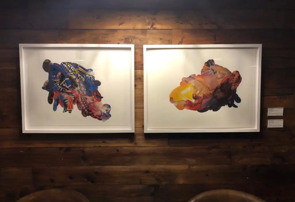 Two pieces by Sara Cardona hang side-by-side at Chef's Palette, CANVAS' restaurant.