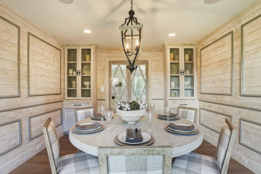 The dining room features a custom wall treatment.