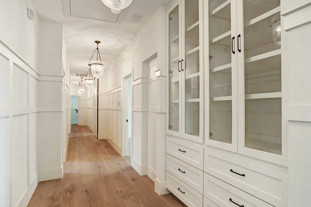 The upstairs hallway has built-ins galore.