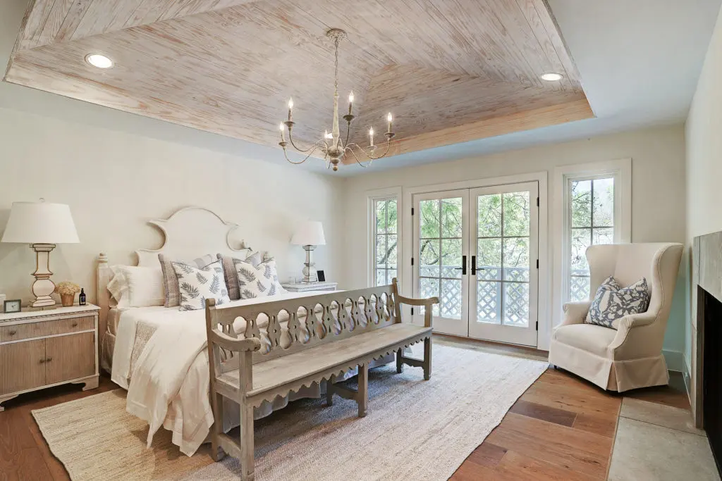 The master bedroom has a vaulted ceiling and fireplace.