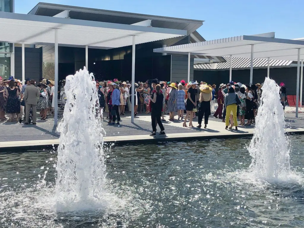 The mis en scène includes fountains, frocks and fancy hats at the Hermann Park Conservancy 'Hats in the Park' luncheon. (Photo by Shelby Hodge)
