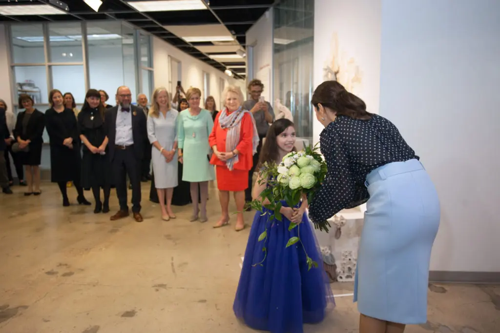 Her Royal Highness, the Crown Princess of Denmark and flower girl Iben Pedersen at the Houston Contemporary Craft Center opening of the Danish Arts Foundation jewelry collection. (Photo by Katy Anderson)