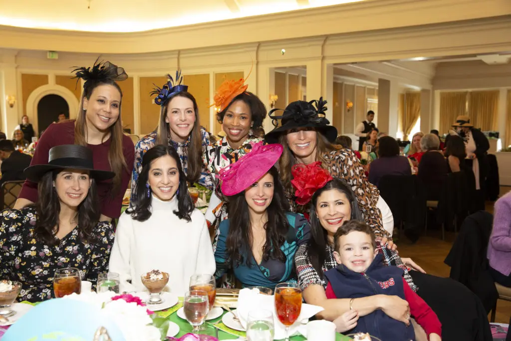Honoree Kristy Bradshaw with her son and a table of friends at the Easter Seals of Greater Houston Hats Off to Mothers luncheon. (Photo by Jenny Antill Clifton)