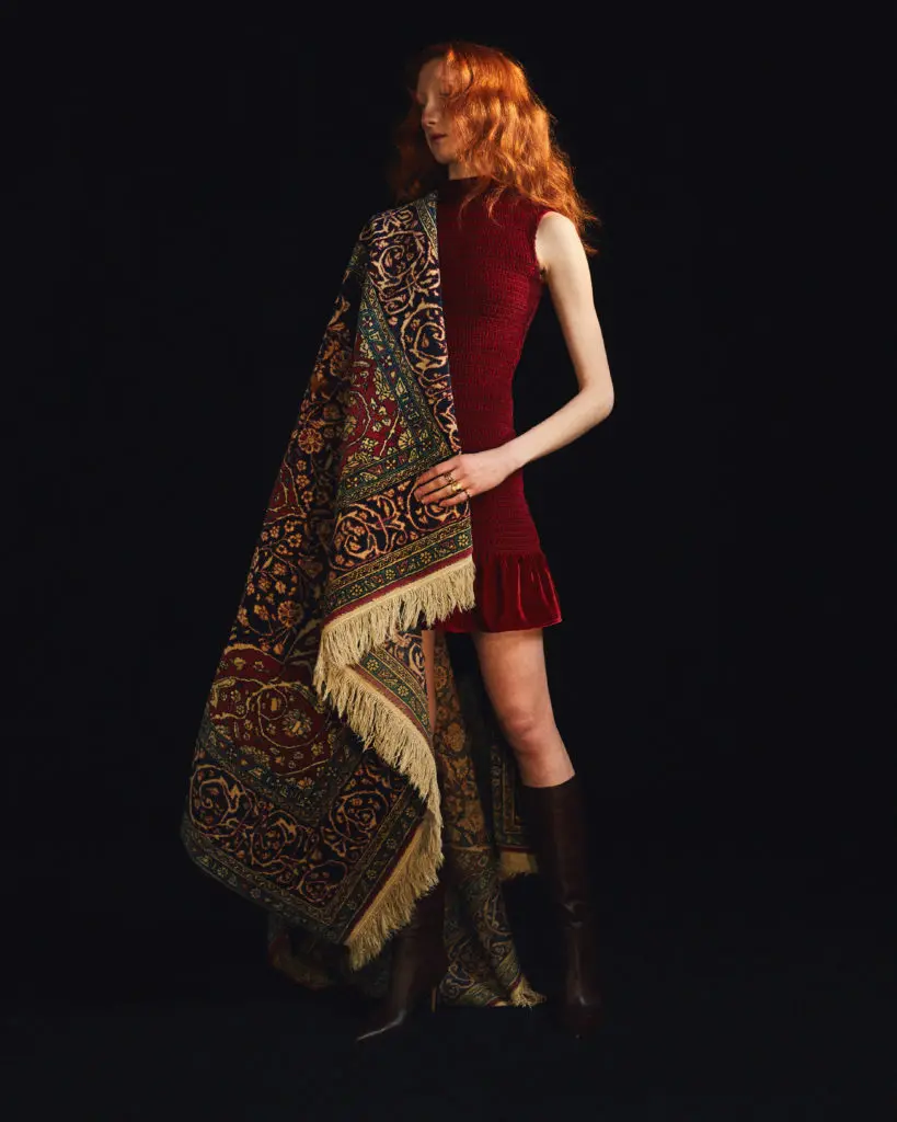 Amir Taghi chose colors from a Persian rug in his family's Houston home for the fall collection, which including this dress in a deep burgundy shade. (Photo by Amir Taghi)