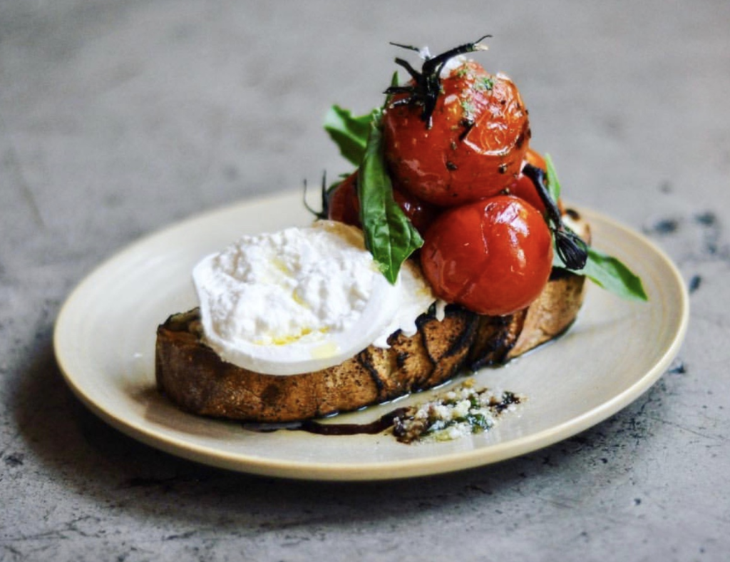 The house-made burrata at Red Ash is a fan favorite.