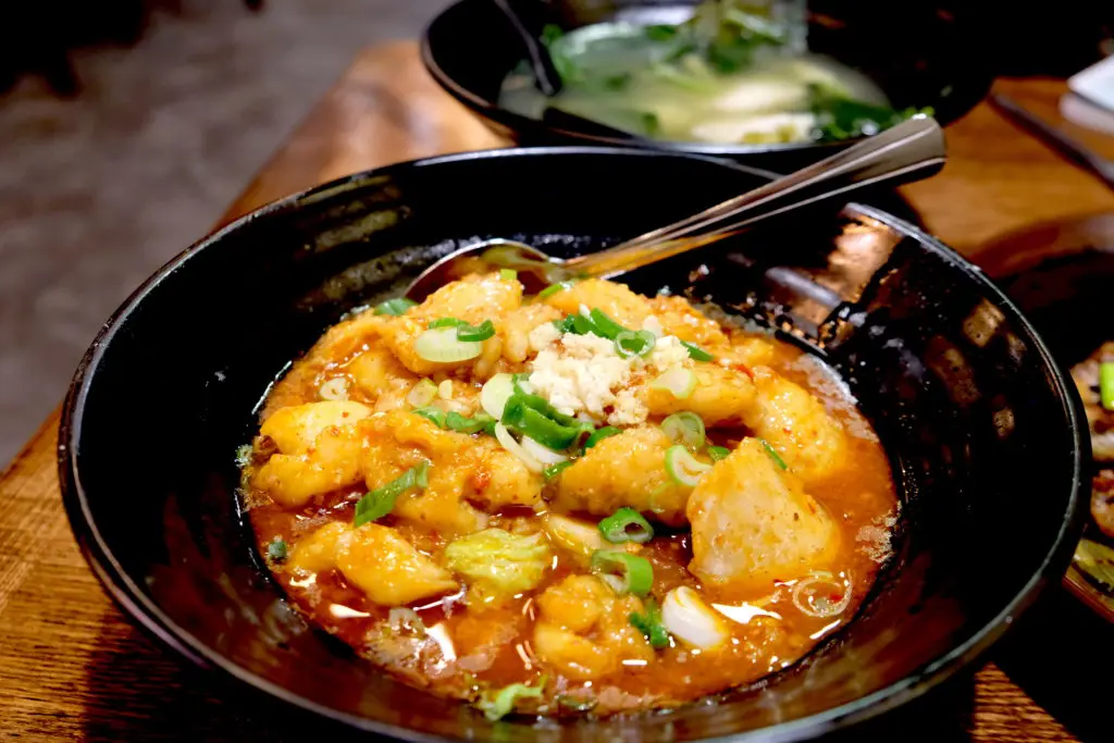 Wula Buhuan's menu includes spicy boiled fish.  (Photo by Mai Pham)