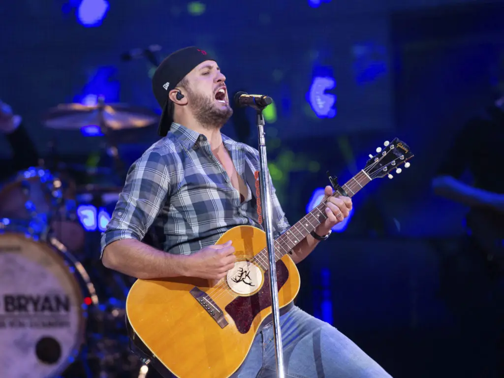 At some point during the show, Bryan's shirt became egregiously unbuttoned.  (Photo by F. Carter Smith )