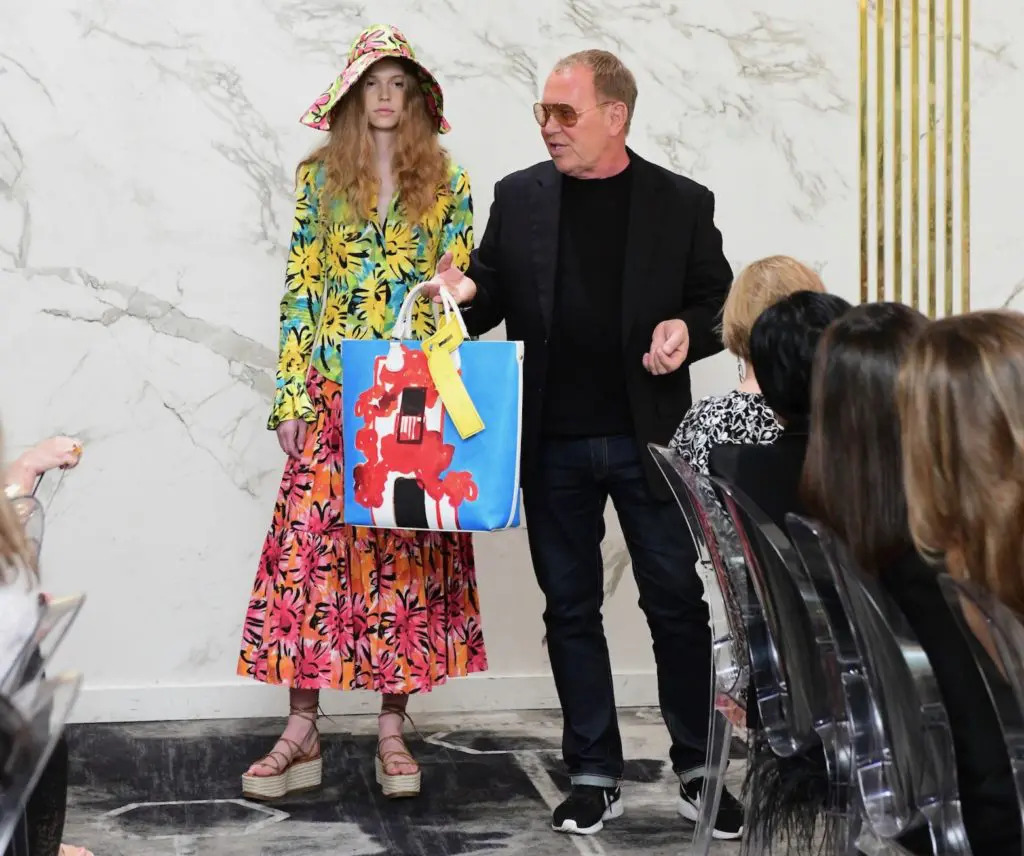 At Saks Fifth Avenue Michael Kors showcases his collection of hand-painted totes for summer outings. (Photo by Daniel Ortiz)