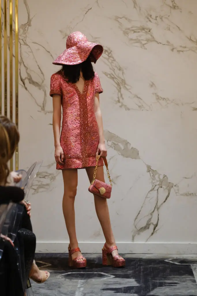 The Michael Kors cocktail dress, shown at the Saks Fifth Avenue luncheon, has matching hat, shoes and handbag.  (Photo by Daniel Ortiz)