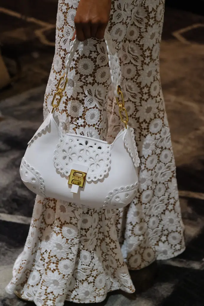 A Michael Kors good idea starts with a dress and includes a stunning handbag. (Photo by Daniel Ortiz)