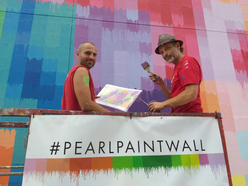 Sebastien "Mr. D" Boileau (right) and a French street-art colleague on the final day of creating "Pearl Paint Wall" (Photo by the author)