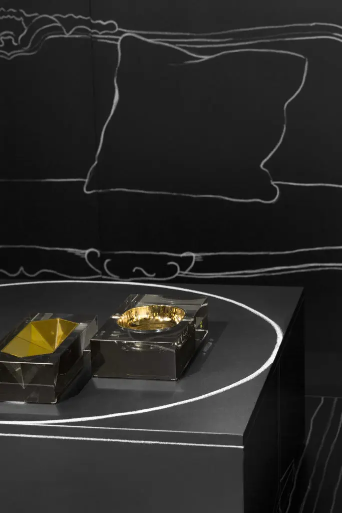 A graphic black backdrop with white chalk create a scene of both glamour and elegance.