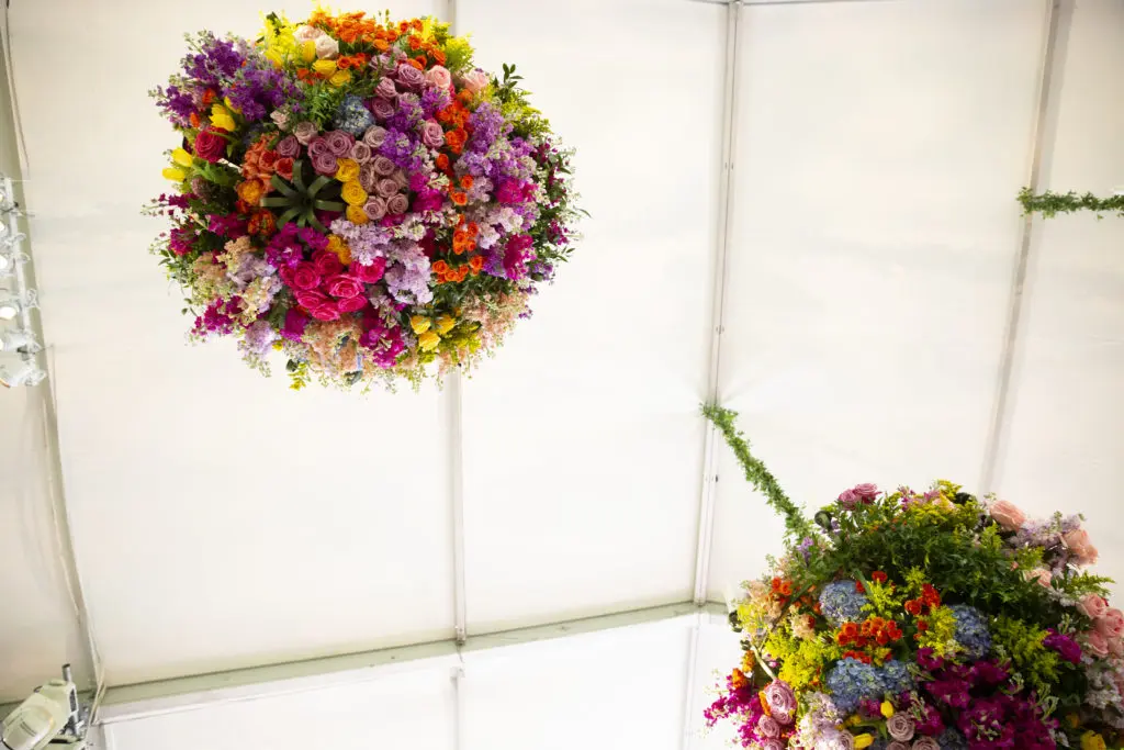 Flower-decked globes dangle from the tent ceiling at the Bayou Bend Garden Party.
(Photo by Jenny Antill Clifton) 