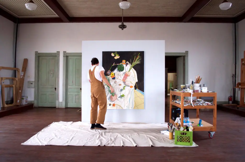 Bradley Kerl painting in the third-floor studio at 100W, Corsicana, Texas (Photo by Kyle Hobratschk)