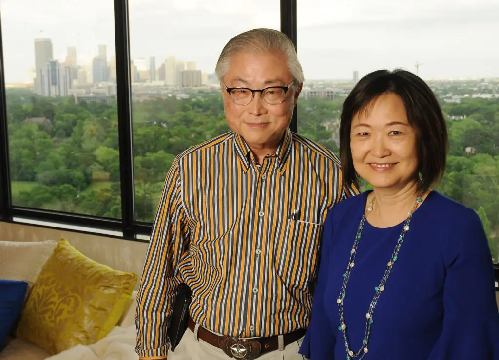 Hosts Peter and Theresa Chang at the KNOWAutism dinner held in their high-rise home.  (Photo by Dave Rossman)