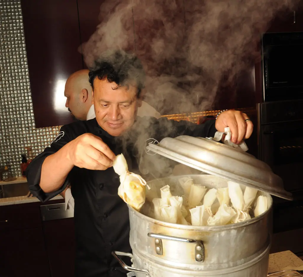 Hugo Ortega cooks for the KNOWAutism dinner in a private home. (Photo by Dave Rossman)