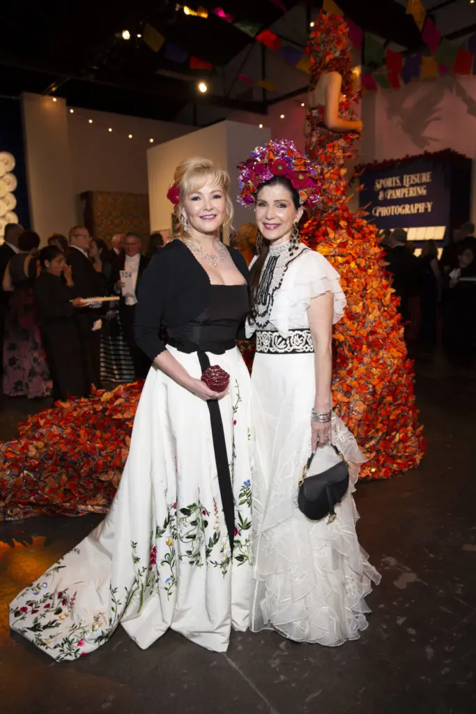White tie attire means floor-length gowns for the ladies. Whitney Crane picked up her embroidered Oscar de Renta gown only two hours before the Houston Grand Opera Ball. Cynthia Petrello channeled Frida Kahlo. (Photo by Jenny Antill)