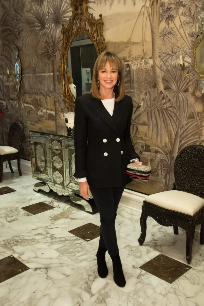 Janet Gurwitch in her uniform blazer, white shirt and jeans at a luncheon at Moxie in April. (Photo by Emile C. Browne)