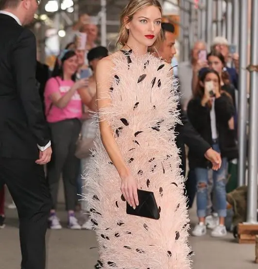 Model Martha Hunt wore a Jason Wu feather dress to the Time 100 Gala. The next day Wu hand-carried the dress to Houston for a runway show at the Children's Assessment Center luncheon.  (Instagram: @JasonWu)