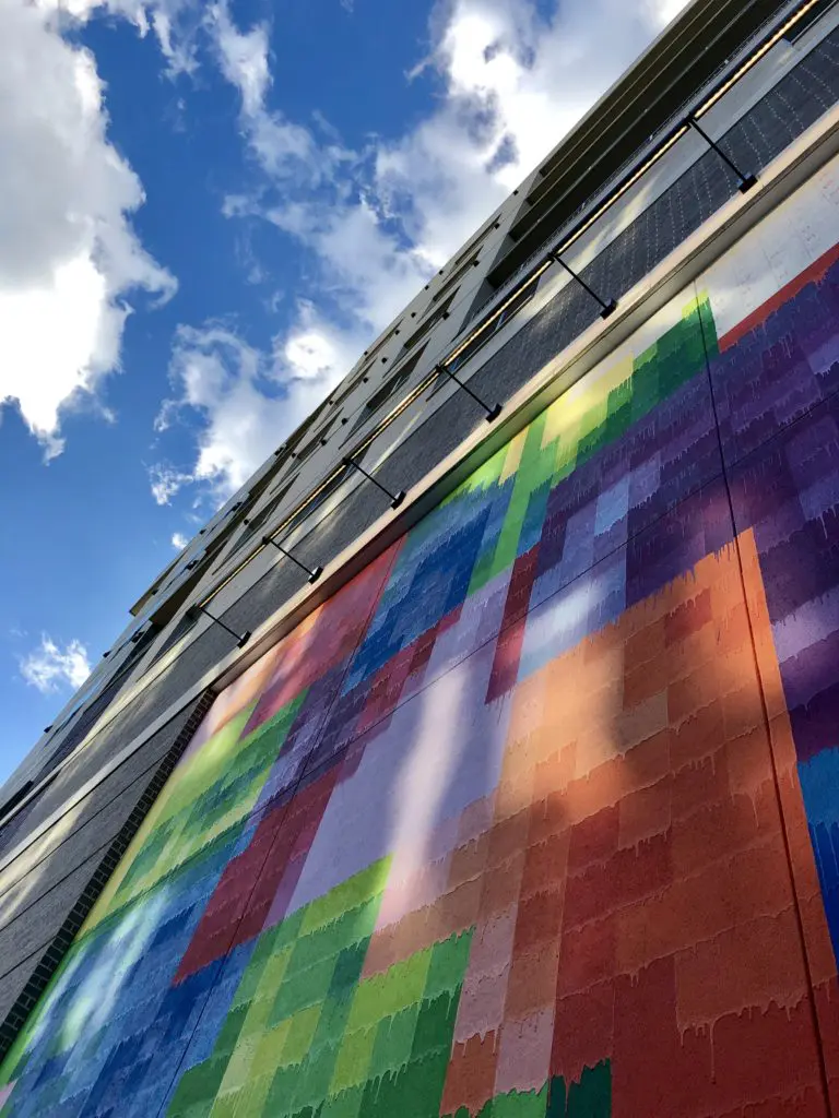 Both abstract and representational, the pixelated grid of "Pearl Paint Wall" tells a story of "a bright, energetic city, colorful, diverse," says its creator, Mr. D.