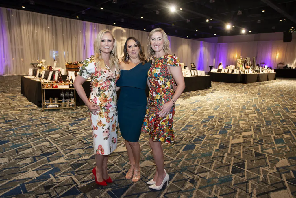 Laura Everson, Katrina Savage, Christin Allphin at the Giving Goes Glam fundraiser. (Photo by Jen McDonald for Interfaith of The Woodlands)
