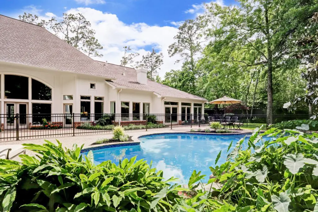 The house at 12014 Tall Oaks sits on more than an acre of tree-shaded land in the heart of Memorial. (Photo by TK Images)