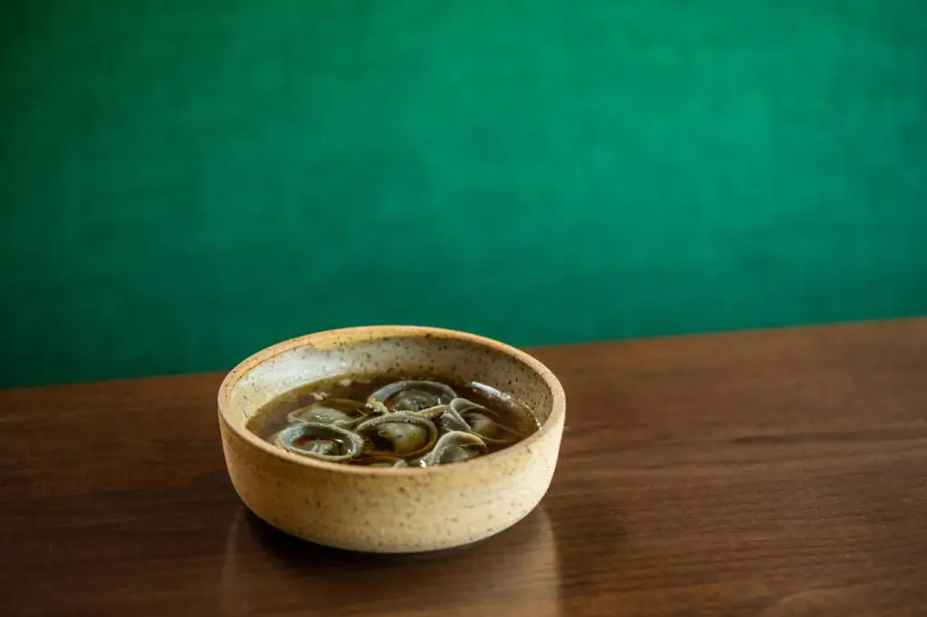 Recado negro tortellini with charred onion broth at Homewood (Photo by Reed Kenney)