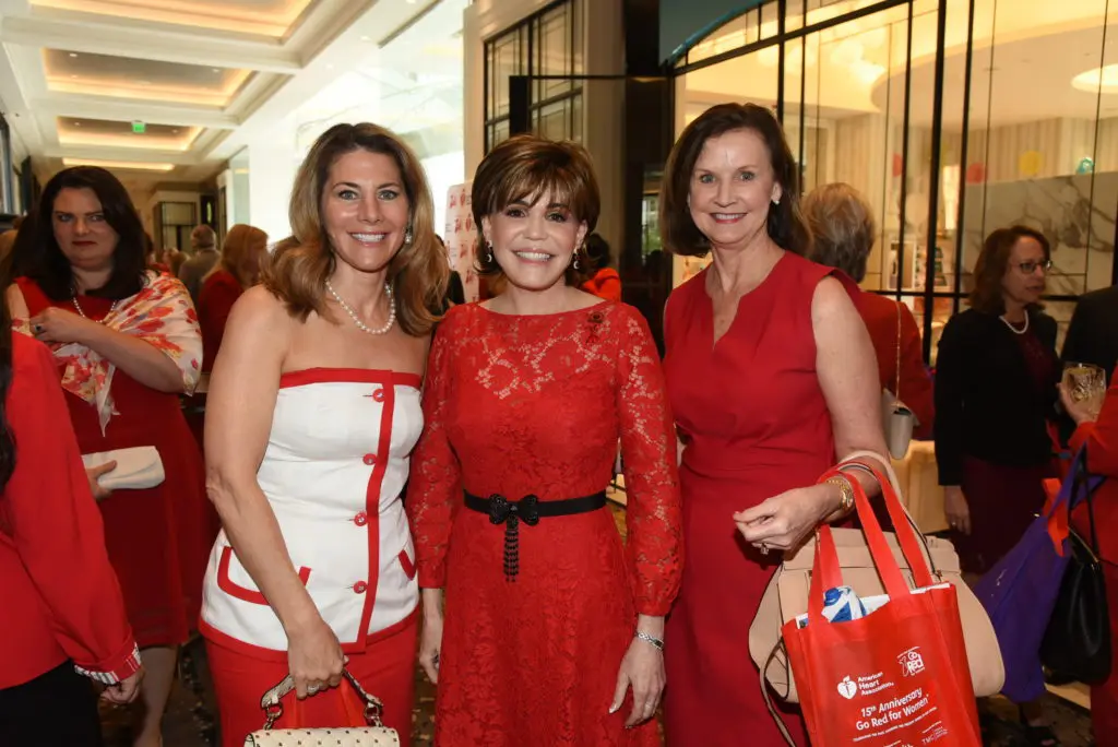 Allison Lewis, chair Hallie Vanderhider, Sandy Scott at the American Heart Association Go Red for Women luncheon. 