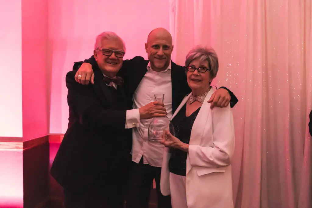 Chair Bruce Flohr, honoree Trevor Paglen, chair Janet Flohr at Artpace's The Happening: Diskoteka Nite. (Photo by Beth Devillier)