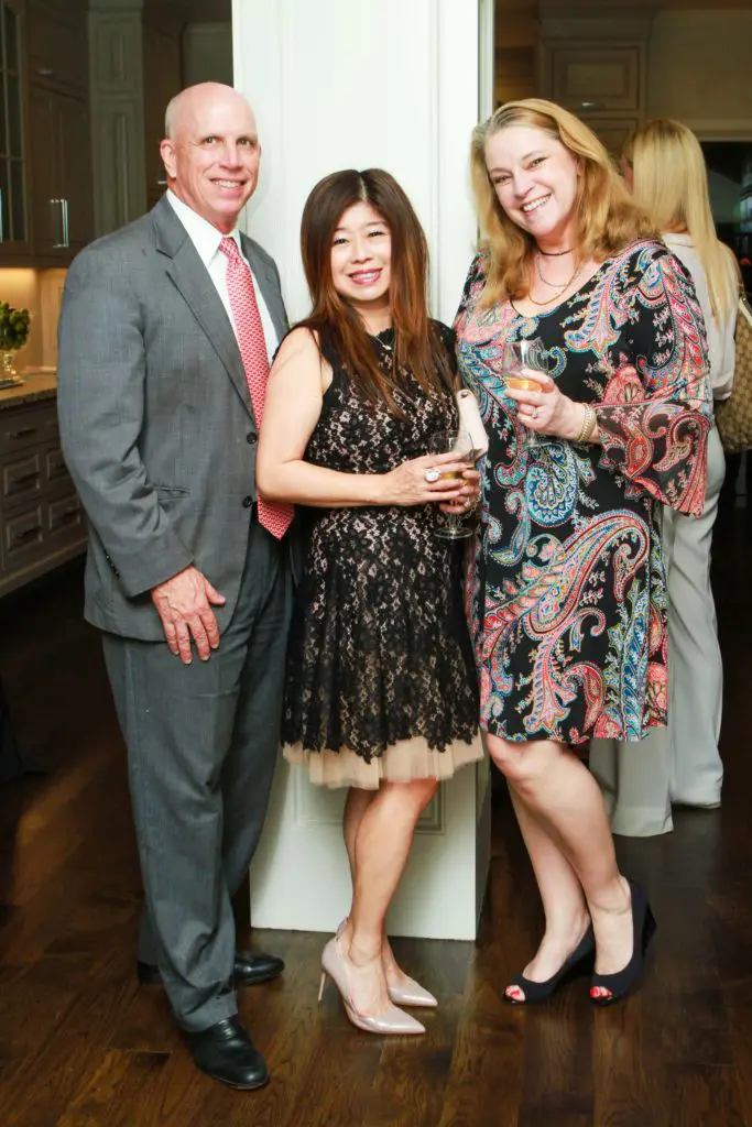 David Webster, Rose Chen, Lisa Lehman at the John Daugherty Realtors Spring Soirée open house at 12014 Tall Oaks. (Photo by Chris Bachman)