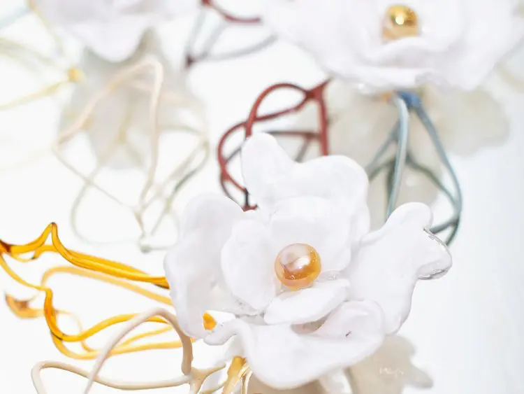 Anna Curnes creates glass art, such as flowers and murals.  (Photo by Sara Kerens)