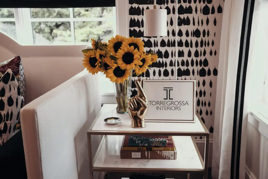 Fresh cut sunflowers on marble living room table at ASID Show House Preview