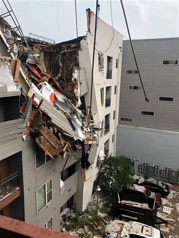 A crane collapsed into Elan City Lights apartments in Deep Ellum, killing a 29-year-old woman. Photo by Ryan Loewe via Twitter