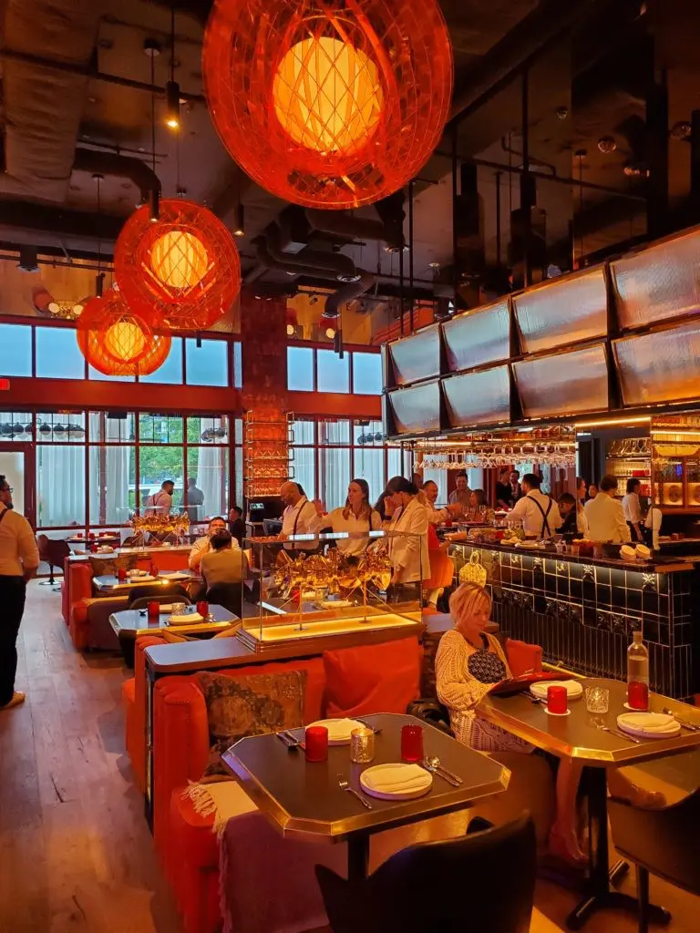 The terra cotta-hued sofas adjacent to the bar are a favorite of those wishing to see and be seen. (Photo by Shafik I. Rifaat)