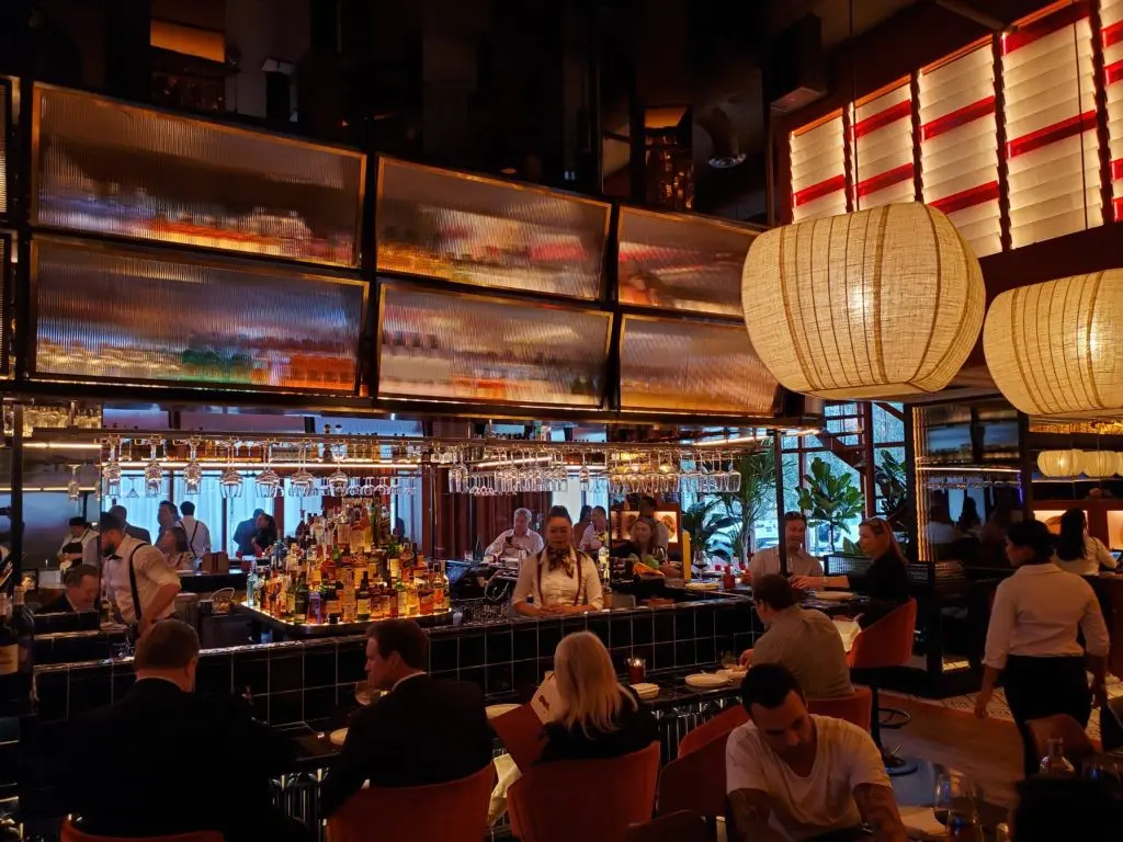 Lower level bar front seating invites leisurely dining at MAD in River Oaks District. (Photo by Shafik I. Rifaat)