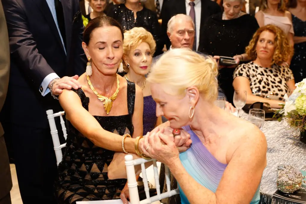 A poignant moment between Sue Smith and close friend Trish Morille. (Photo by Priscilla Dickson)