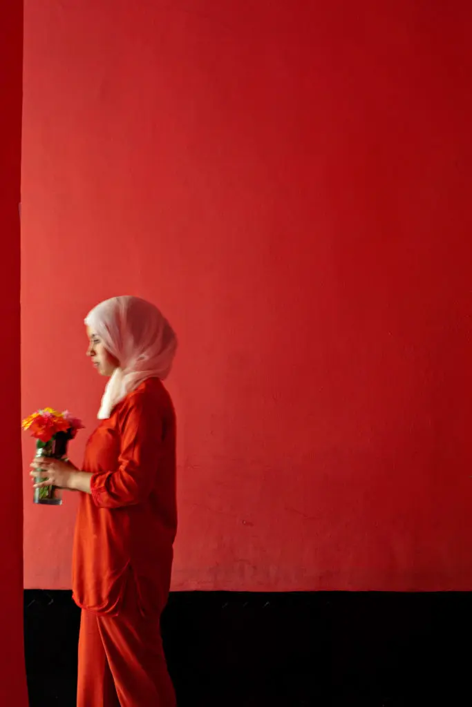 A hotel worker delivers flowers to a guest room in Marrakech's hotel El Fenn.(Photo by Joanna Vestey)