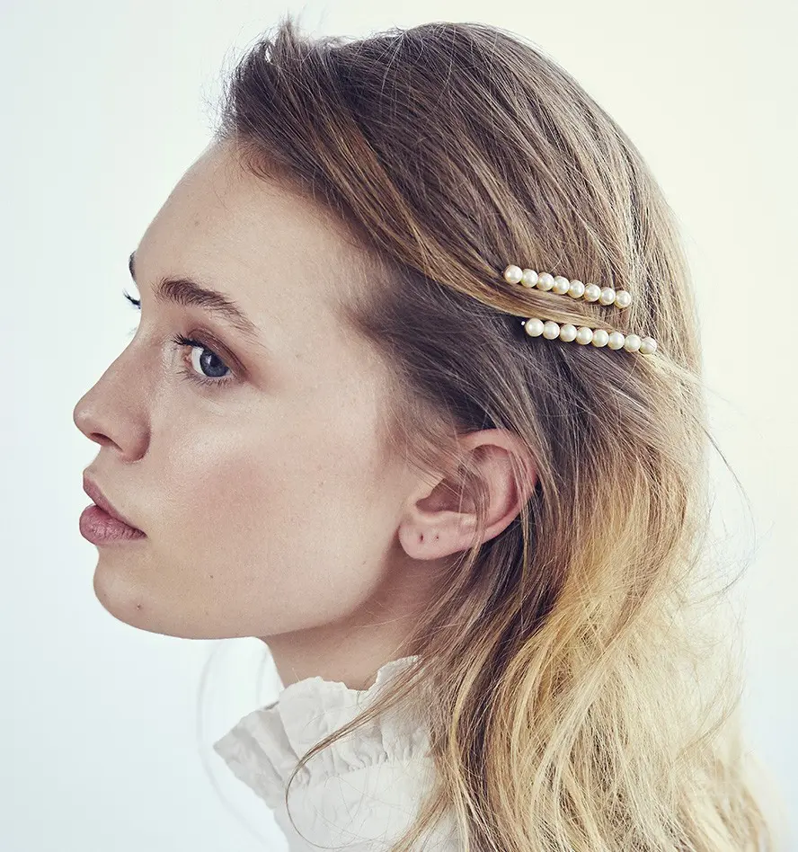 Go ahead and layer up the bobby pins this summer for a cool, more-is-more look.
