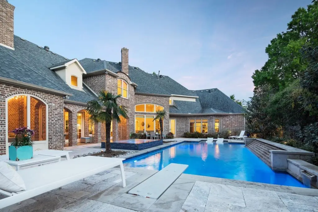 The oversized pool features an infinity spa. 