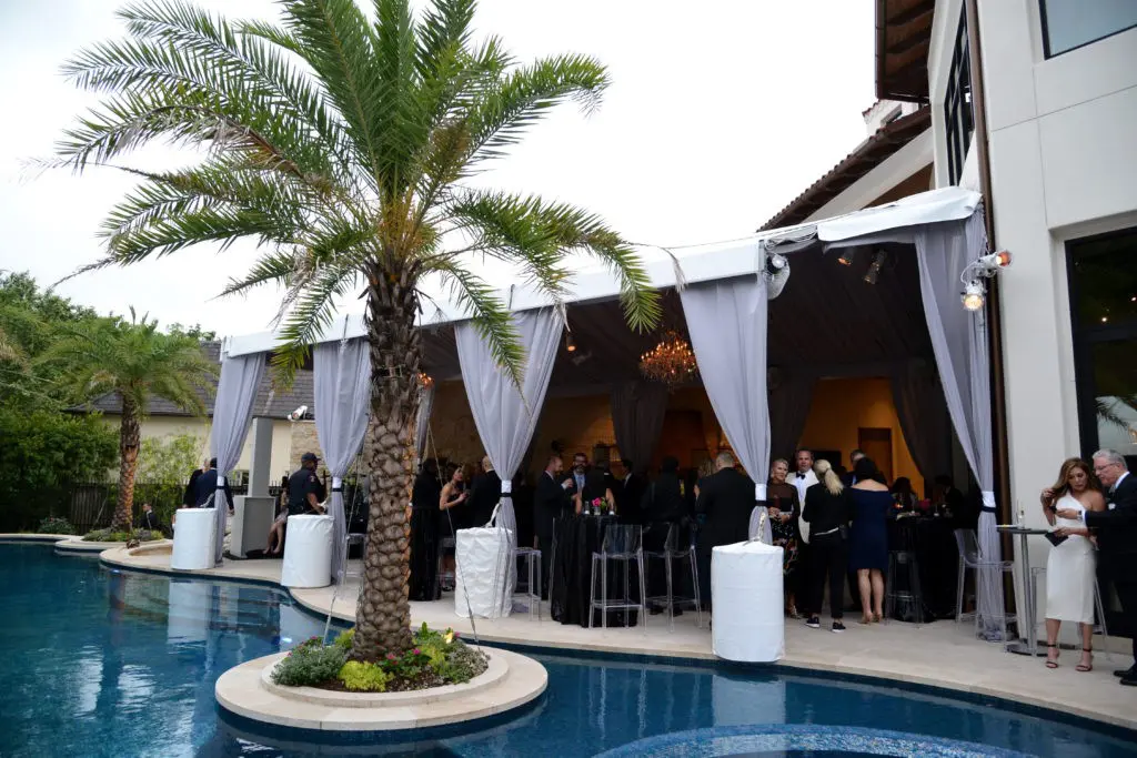 Silken party tents with crystal chandeliers provide ample party space at the Theorem Wine release event. (Photo by Al Torres Photography)
